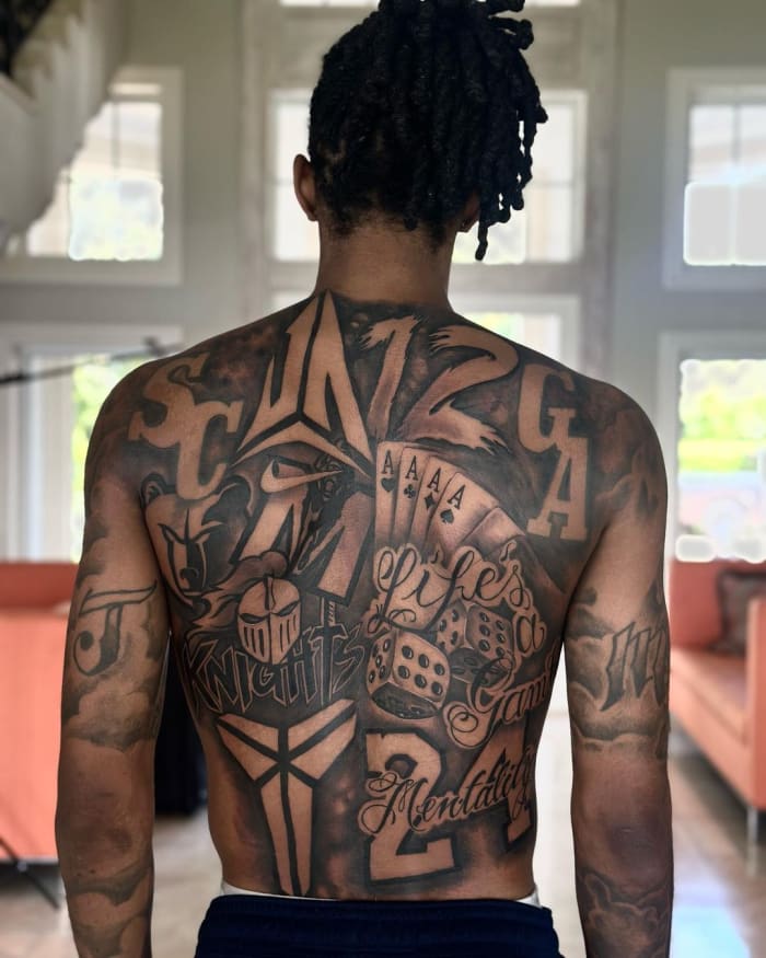 View of Ja Morant's back tattoos.